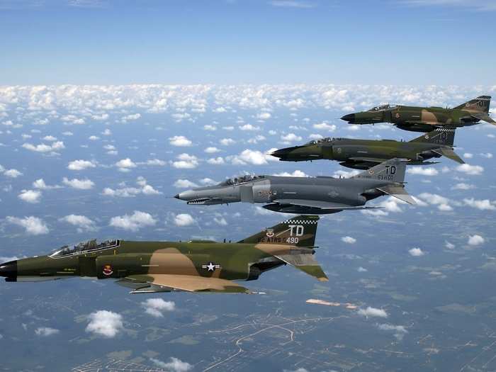 A formation of F-4 Phantom II fighter aircraft display their unique camos in formation during a heritage flight demonstration here.
