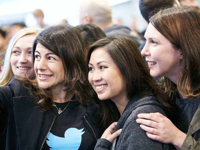 Employees take a Twitter selfie.