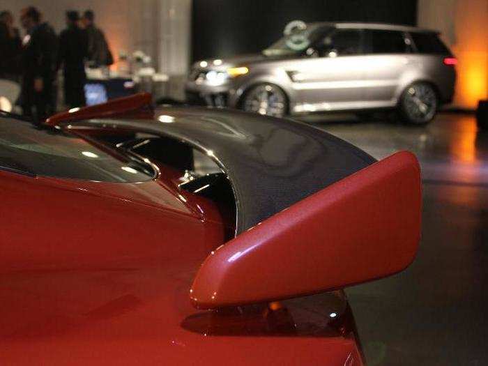 Its carbon fiber spoiler moves up and down to improve aerodynamics.