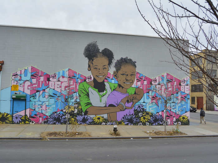 In Bushwick, this wall mural of two girls by Chris Stain and Billy Mode is a reflection of the community
