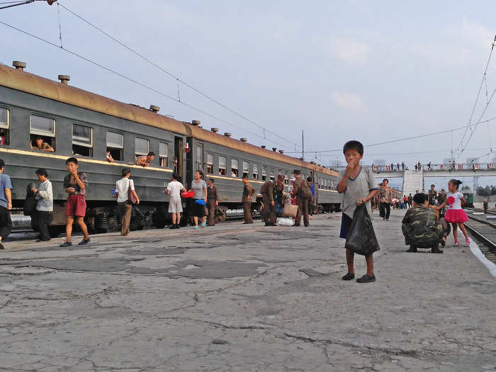 But anytime the train pulled into a station, there were painful reminders of the poor living conditions. This little boy begged for money at a station in Hamhung.