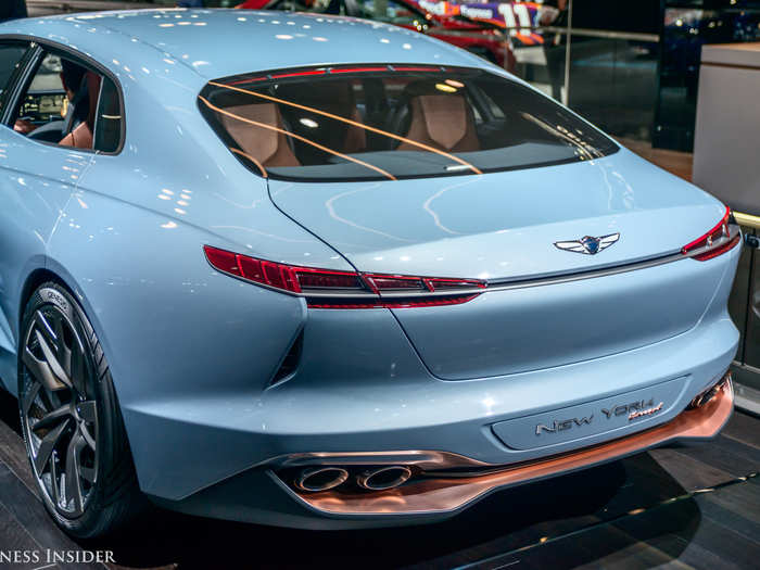 The heavily curved rear-end gives the car a fastback look that