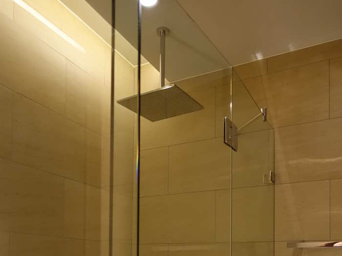 The shower room was well-designed and had a large rain shower head.