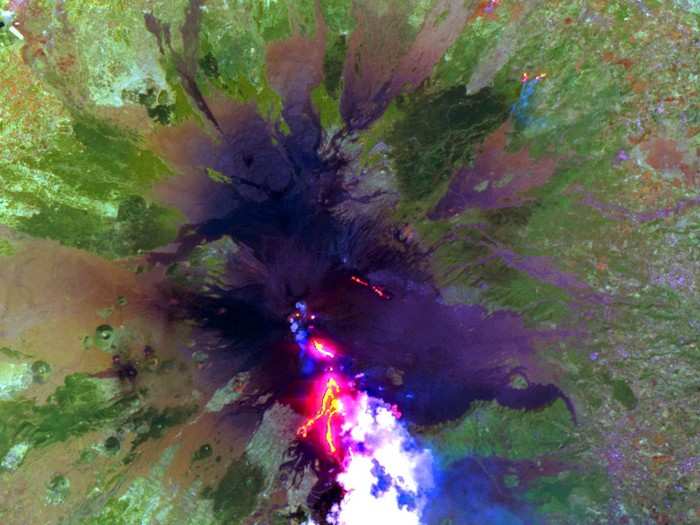 Red-hot lava flows out of Mount Etna in Italy.