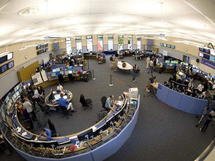 The room is organized in the shape of a quadruple magnet, and each pod is dedicated to a different machine, so more than just the LHC is controlled here.