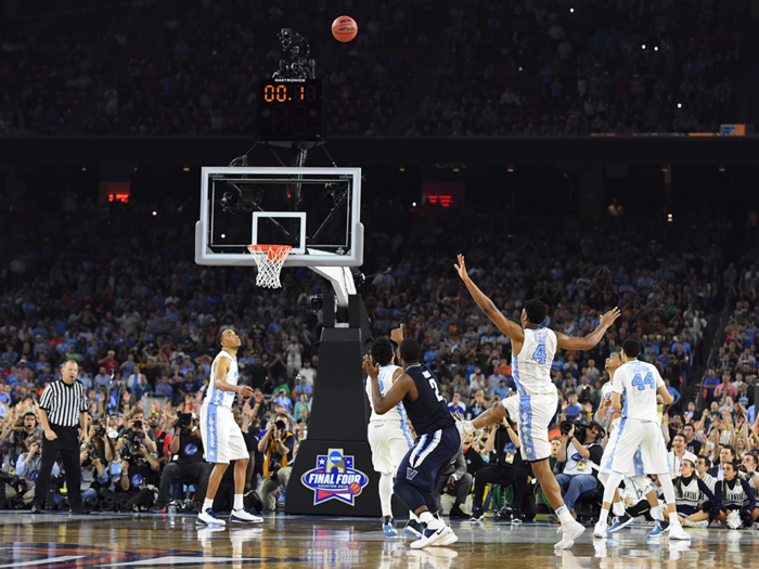 But that was quickly dashed by what may go down as the greatest shot in college basketball history. Here, Kris Jenkins watches as his shot travels through the air, 0.1 seconds remains on the clock at its apex.