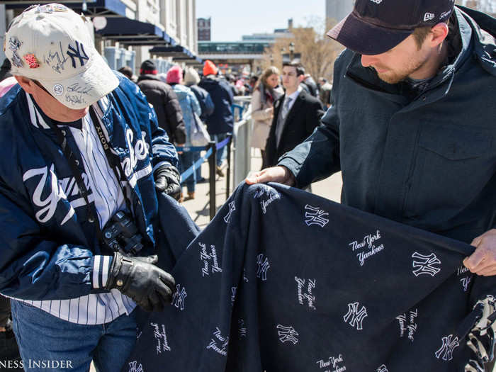 The cold weather required fans to wear layers and bring blankets, but that did not hide their Yankee pride — this man brought a New York Yankees blanket that his daughter made him so he could stay warm and still represent his team.