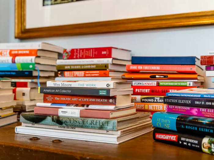 Stacks of books showcase eclectic taste. "If you want to read in bed, make it a real book or an e-reader that does not emit blue light. And make sure it is not work-related," read the house rules on the Airbnb listing.