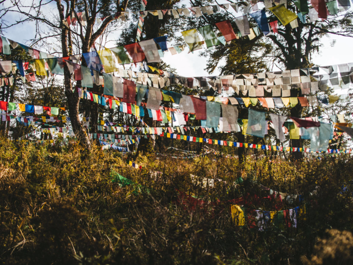 The most common religion practiced here is Buddhism, and prayer flags can be seen throughout the country. "Their mindset is that every part of nature is holy in some way, so if they find a spot where the wind blows through a grove of trees in a lovely way, that