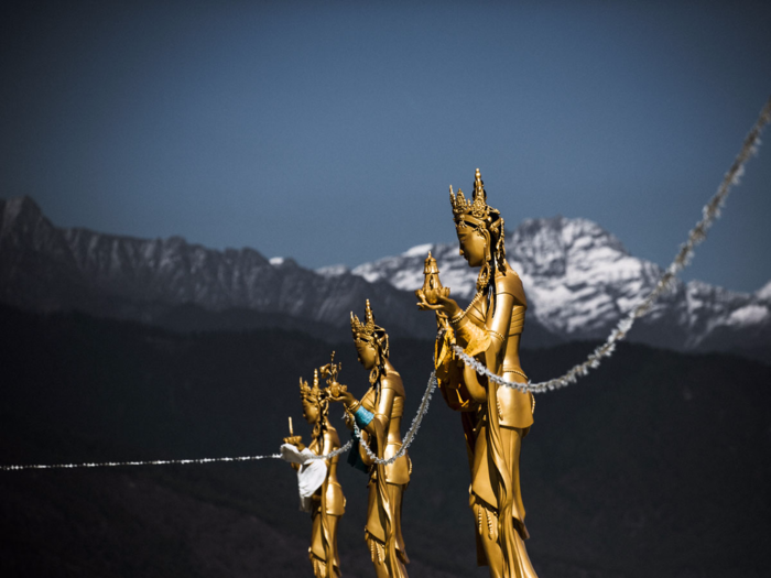 While traditional elements like these Dakinis, or angels of the Buddhist world, can be seen above the capital, the influx of technology continues. "These people have lived so simply for so long, cut off from the rest of the world, and now it