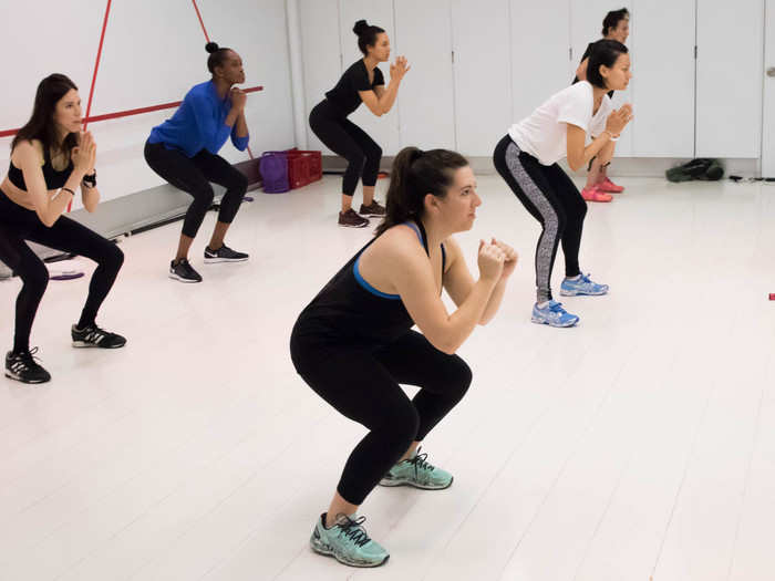 The first part of the class is all about strength training: a rapid series of squats and lunges. Olajide counts down the movements and keeps you going much longer than you want to.