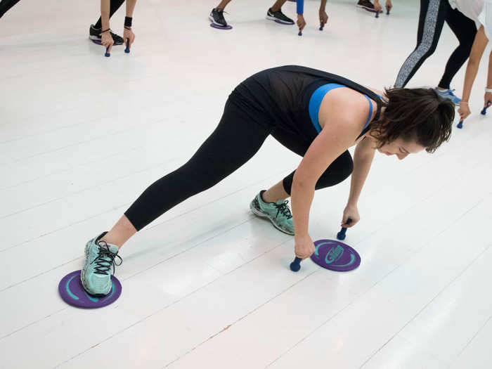 Tiny weights are used to stabilize the upper body in another sideways lunge sequence.