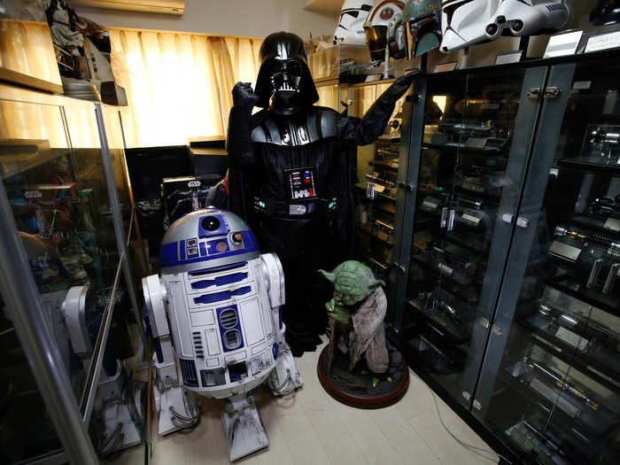 Testuyuki Nakagawa poses as Darth Vader and claims that his wife cannot understand why he buys so many lightsabers.