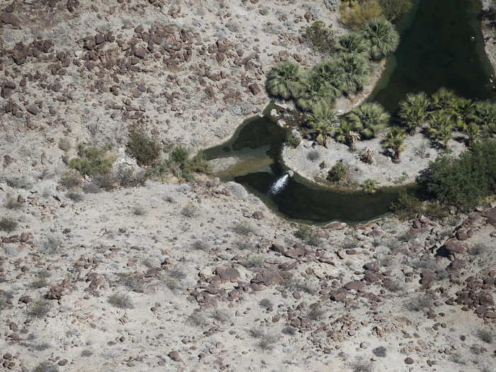 Water flows into a dried-out lake on a golf course in La Quinta.