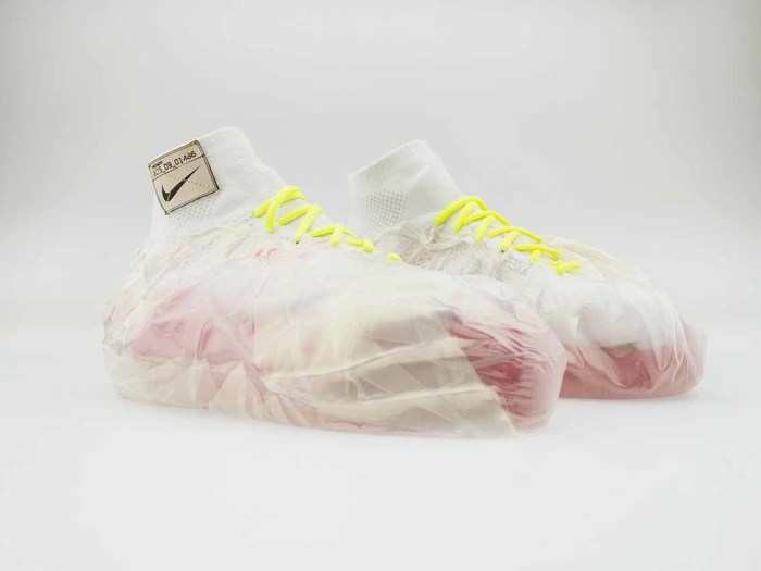 Wrapped around these shoes for impact protection are plastic bags filled with kinetic sand for an adaptive cushioning system.