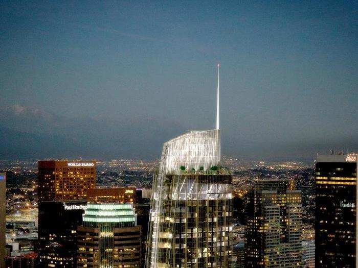 This rendering illustrates the expected nighttime look of the tower, with a brightly-lit "sail" at its peak.