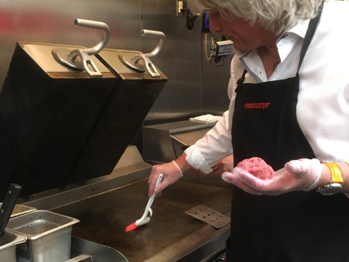 The hot (385 degree) grill top is coated with unsalted butter, so the burger won