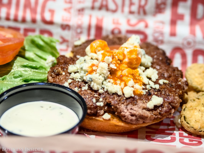 The burger can be topped in any number of ways. Smashburger prides itself on offering a wide variety of options, with variations like the buffalo and blue-cheese burger.