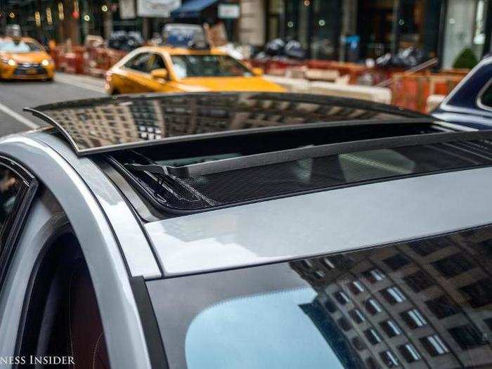 Instead of the roof retracting, the glass panel levers itself up and out of the car.