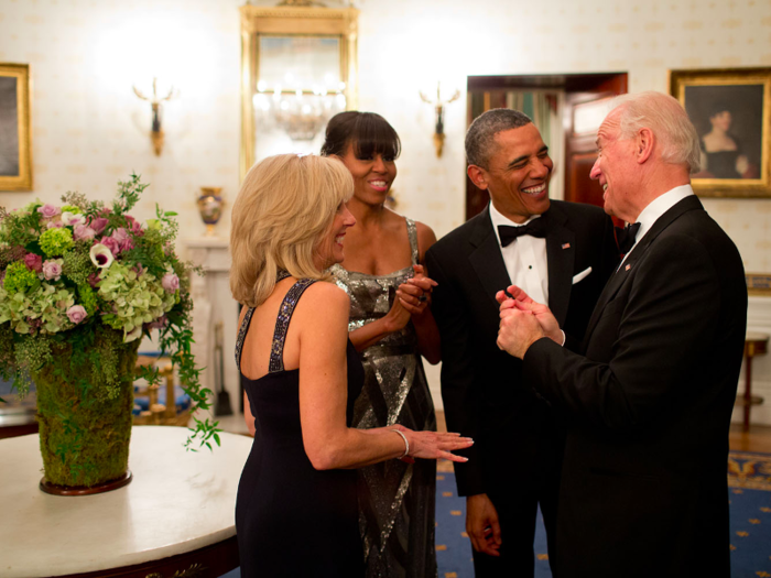 The Obamas joke with the Bidens in the Blue Room of the White House before the National Governors Association Dinner.