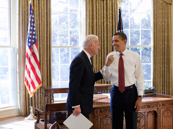 Obama and Biden share a laugh in the Oval Office.