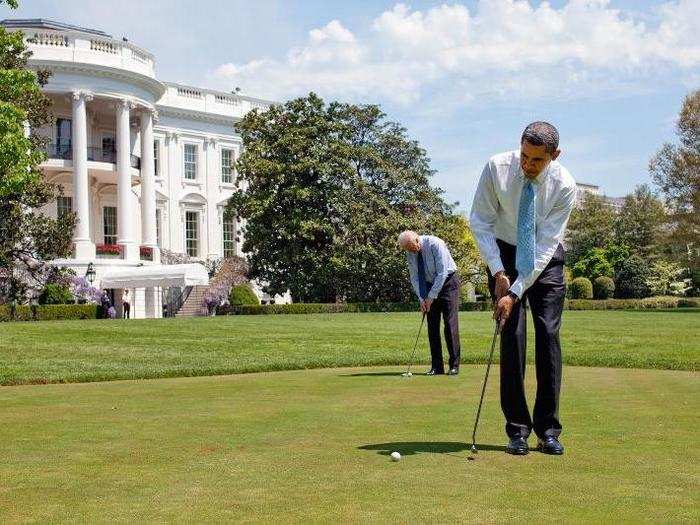 Obama and Biden practice their putting on the White House putting green April 24, 2009.