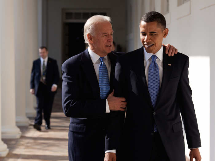 Obama walks with Biden along the Colonnade.