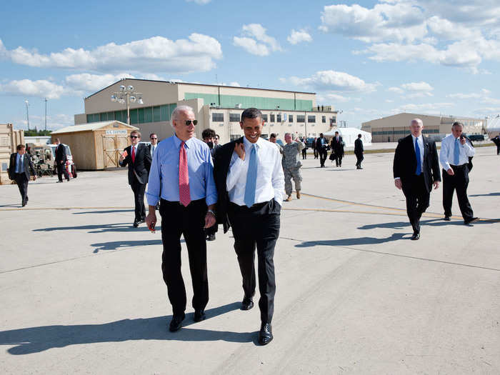 Obama walks across the tarmac with Vice President Joe Biden prior to departure from Fort Campbell, Kentucky.