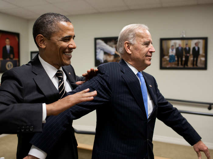 Obama jokes with Biden backstage before the STOCK Act signing event in the Eisenhower Executive Office Building South Court Auditorium, April 4, 2012.