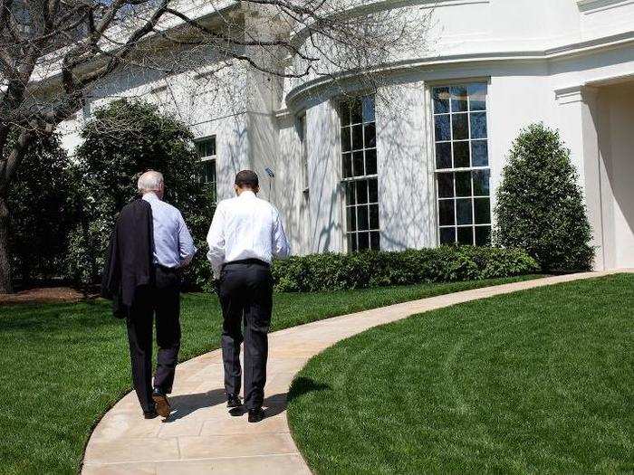 Obama and Biden walk back to the Oval Office after putting on the White House putting green April 24, 2009.