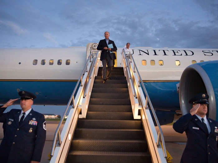 Walking down the stairs of Air Force Two at New Castle County Airport in Wilmington, Delaware on Aug. 23, 2013.