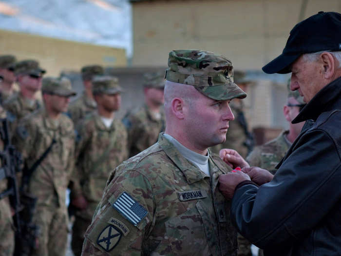 Here, Biden pins a Bronze Star on Staff Sergeant Workman at Forward Operating Base Airborne in Wardak Province, Afghanistan on January 11, 2011.