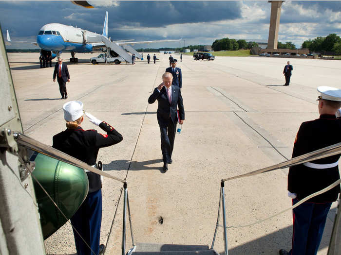 Saluting as he approaches Marine Two after landing at Joint Base Andrews aboard Air Force Two on June 6, 2012.