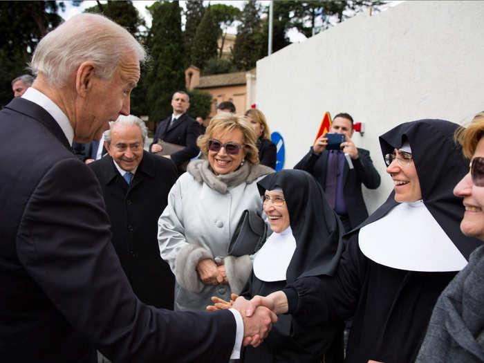 Biden says a quick hello to a group of nuns after attending the Inauguration Mass for Pope Francis in Vatican City on March 19, 2013.