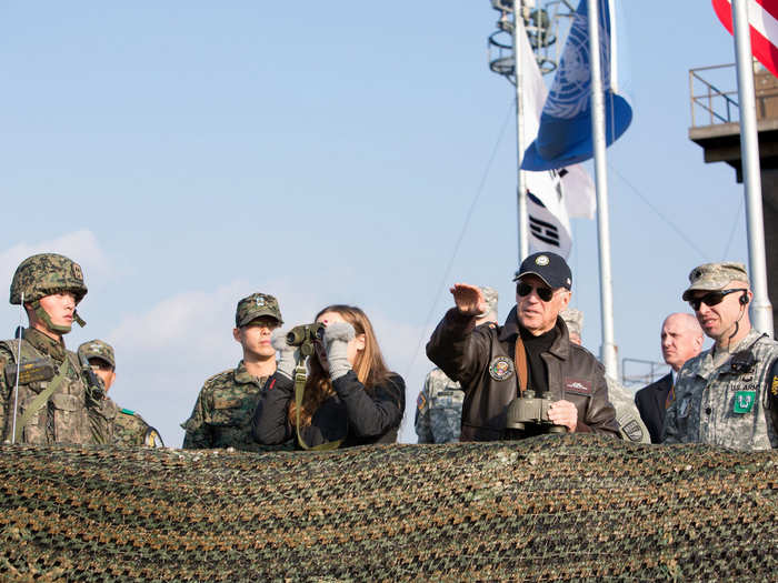 Biden and his granddaughter, Finnegan Biden, look out over the De Militarized Zone on December 7, 2013.