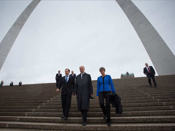 Biden walks under the Gateway Arch with St. Louis Mayor Francis Slay (left), and Secretary of the Interior, Sally Jewell on May 13, 2014.