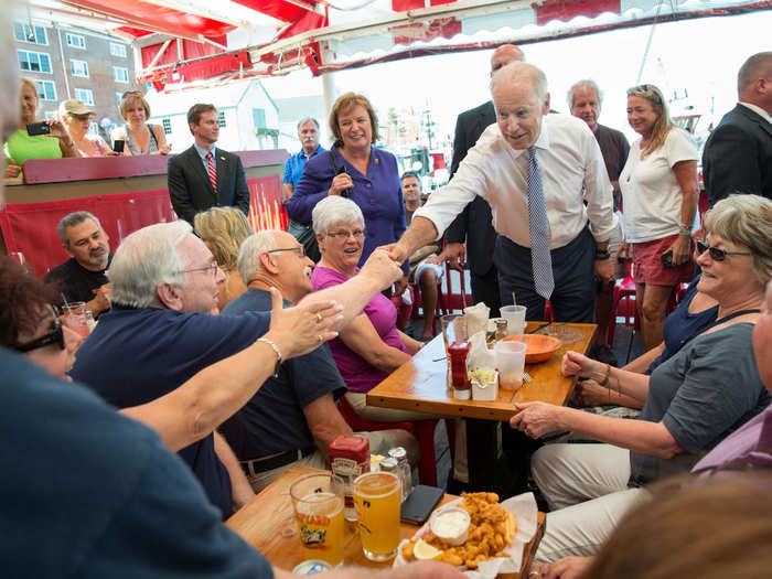 Congresswoman Carol Shea-Porter and Biden shake hands before eating lunch at the Old Ferry Landing in Portsmouth, New Hampshire on Sept. 3, 2014.