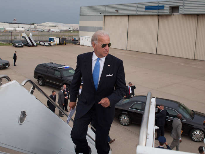 Vice President Joe Biden jogs up the stairs to Air Force Two at Lambert St. Louis International Airport, in St. Louis, Missouri, August 20, 2010.