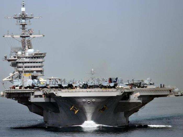 The Nimitz-class aircraft carrier USS Carl Vinson (CVN 70) transits the Strait of Hormuz.