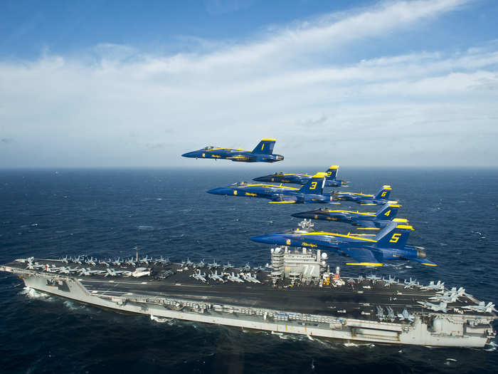 Blue Angels fly over USS George H.W. Bush in the Atlantic ocean.