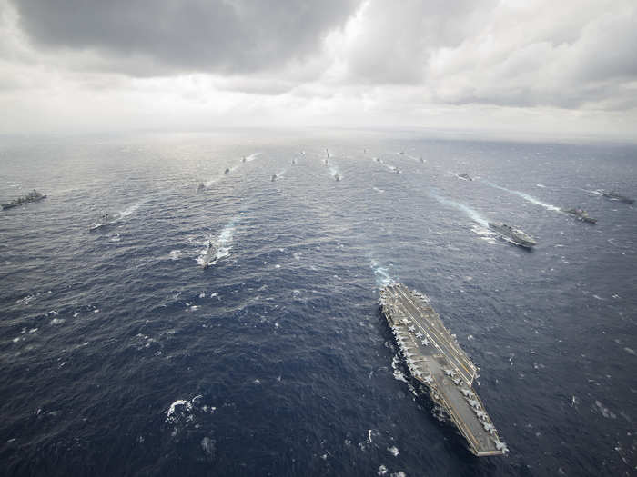 The aircraft carrier USS George Washington (CVN 73), center-right, leads the George Washington Carrier Strike Group.