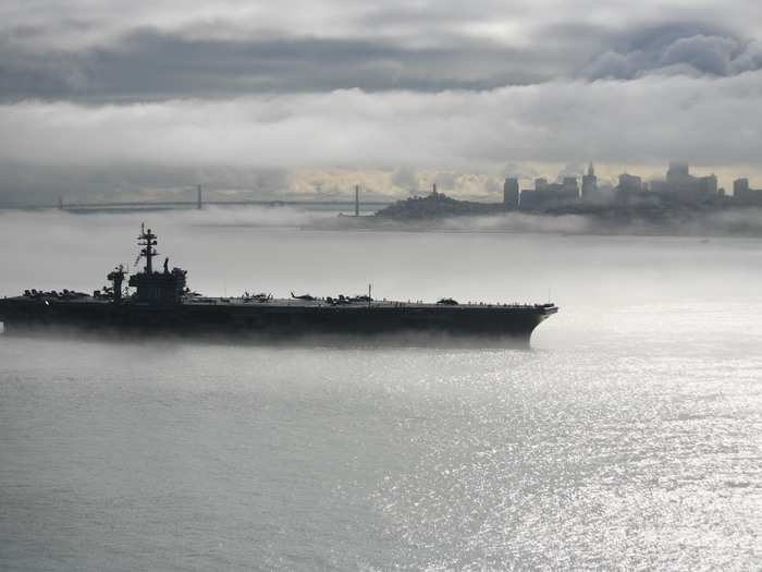 The Nimitz-class aircraft carrier USS Carl Vinson (CVN 70) departs San Francisco.