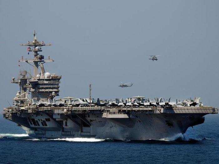 The Nimitz-class aircraft carrier USS Carl Vinson (CVN 70) transits the Strait of Hormuz.