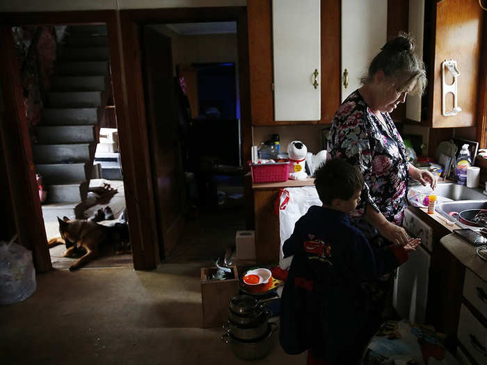 Strider, who takes multiple medications resulting from his early childhood abuse, gets his morning meds from Lannette in their new home. "We haven