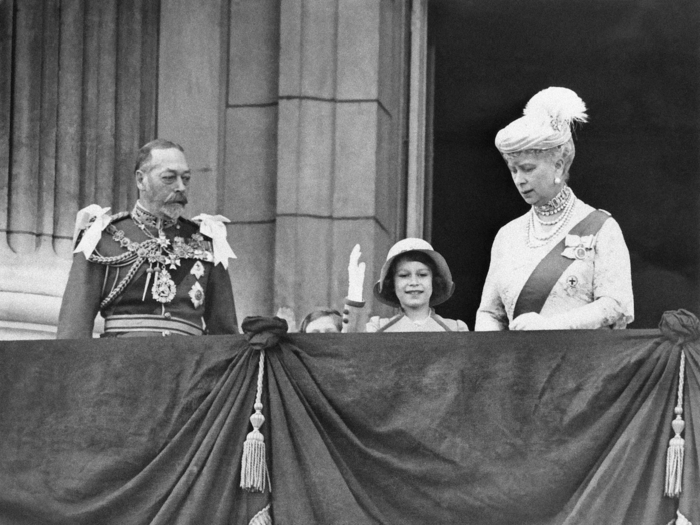 1935: Even at the young age of nine, the future queen had perfected her royal wave. This photo was taken after the family had attended the Jubilee service at St. Paul