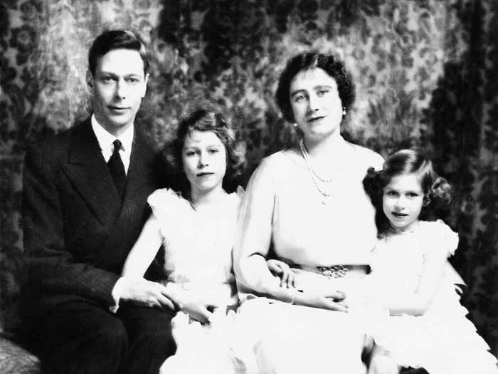 1937: The Queen Mother is shown here with her husband, King George VI, and their two daughters, Princess Elizabeth, centre, and Princess Margaret, in 1937. This is also the year Princess Elizabeth signed up as a Girl Guide — when she was 11 years old.