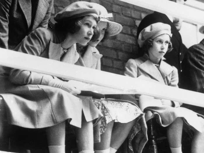 1939: Elizabeth and Princess Margaret, both keen swimmers, went to watch a swimming display given before the royal visitors at Dartmouth Naval College, on July 22, 1939.