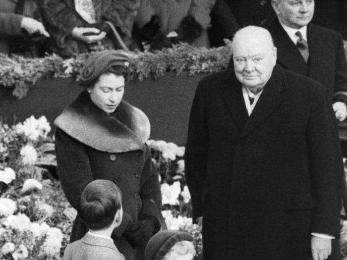 1954: Since coming to the throne, she has held regular audience with 12 prime ministers. In this photo, the Queen and Winston Churchill wait at Waterloo Station in London for the Queen Mother to arrive back from a month in the US.