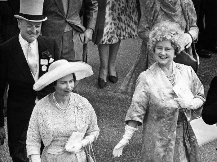 1962: The royals have always been avid race-goers. In 1962, the queen attended the famous Ascot races with her mother. The queen wore a blue lace? dress to Ladies Day while her mother opted for a floral print.