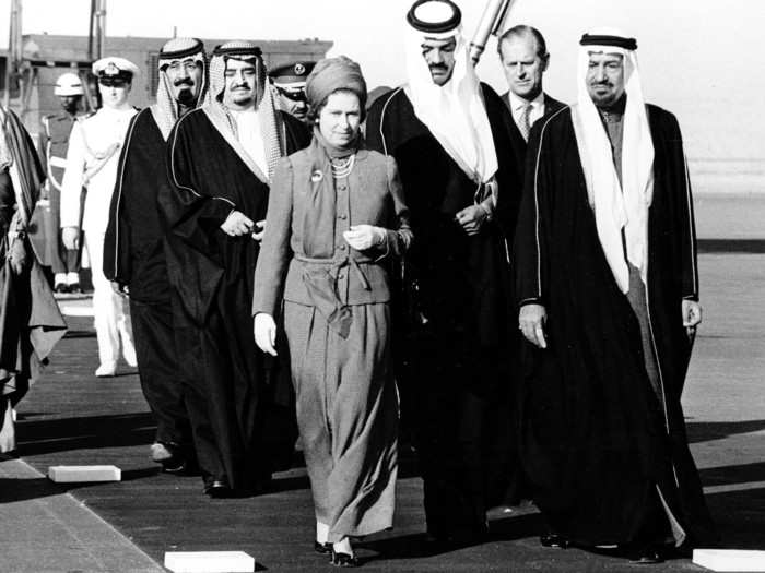 1979: The monarch has been a regular guest of Middle Eastern leaders throughout her reign. Here, she is escorted by King Khali of Saudi Arabia, far right, after her arrival at Riyadh Airport, Saudi Arabia. This was one of just eight official state visits to various countries made that year.